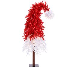 a red and white christmas tree with snow flakes on it's top, in front of a white background