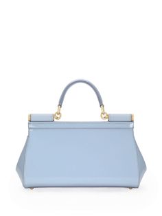 baby blue calf leather patent finish single top handle logo plaque adjustable detachable shoulder strap foldover top with magnetic fastening main compartment internal slip pocket metal feet gold-tone hardware This piece comes complete with a protective dust bag. This item is in size UNI and the color is Blue Elegant Baby, Messenger Bag Backpack, Bottega Veneta Shoulder Bag, Leather Cap, Blue Bags, Handbag Backpack, Sicily, Leather Handbag, Valentino Garavani