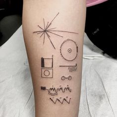 a person with a tattoo on their leg that has different things in the shape of a star