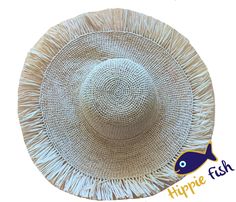 "Crochet Raffia Sun Hat with Fringe A beautiful handmade sun hat for the city or beach that can be dressed up or down depending on your needs. A wonderful gift for a hat lover. 🌀Natural organic raffia hat with fringe 🌀Adjustable with tie 🌀Casual and relaxed yet stunning 🌀Lightweight and easy to flat pack for travel One size fits most. 4\" or 10 cm brim width. Brim to brim 16\" or 41 cm Head size or Inner crown circumference 21-22\" or 55-56 cm max. Natural raffia has a subtle aroma of straw. Bohemian Boater Hat In Toquilla Straw, Bohemian Toquilla Straw Boater Hat In Natural, Spring Festival Palm Leaf Hats, Wide Brim Jute Sun Hat For Vacation, Vacation Wide Brim Jute Sun Hat, Spring Flat Brim Hat With Fringe, Festival Palm Leaf Straw Hat, Natural Palm Leaf Sun Hat For Festival, Bohemian Jute Straw Hat For Beach