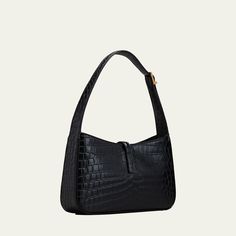 Saint Laurent "Le 5 A 7" hobo bag in shiny crocodile-embossed calf leather Adjustable shoulder strap, 10.2" drop Hook fastening Bronze hardware. Internal zip pocket Approx. 6.3"H x 9.8"W x 2.4"D Item weight, approx. 0.80 lbs. Made in Italy Chic Leather Baguette Bag With Crocodile Pattern, Leather Baguette Bag With Crocodile Pattern For Everyday Use, Luxury Crocodile Pattern Everyday Shoulder Bag, Elegant Everyday Baguette Bag With Crocodile Pattern, Luxury Everyday Shoulder Bag With Crocodile Pattern, 5 A 7 Ysl, Ysl Shoulder Bag, Bronze Hardware, Leather Bag Women