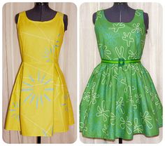 two dresses on mannequins, one in yellow and the other in green