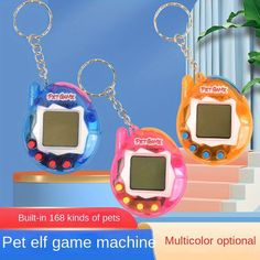 two electronic key chains are shown with the words, pet self game machine and multicolor options