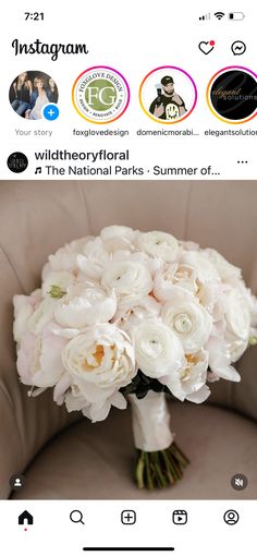 a bouquet of white flowers sitting on top of a chair next to an instagram page