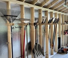 a garage filled with lots of tools and hanging on the wall next to each other