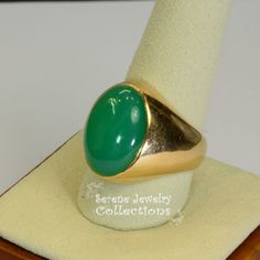 A beautiful simple Chrysoprase cabochon is the centerpiece of this 14k gold ring. It is rare to find chrysoprase in such fine green and even color tone! Ring Size: 9.5 Total Weight: 11.5 grams Precious Metal: 14k Yellow Gold Precious stones: -Chrysoprase Center Stone: 12.2 carats, 18.6mm x 13.3mm Hallmark: 14k Heirloom Green Emerald Oval Cabochon Ring, Heirloom Green Oval Cabochon Emerald Ring, Heirloom Style Green Emerald Ring With Polished Finish, Heirloom Green Opal Round Ring, Heirloom Style Polished Emerald Ring, Heirloom Green Opal Ring, Green Opal Oval Ring In 14k Gold, Green Emerald Oval Cabochon Ring Stamped 14k, Yellow Gold Emerald Chrysoprase Cabochon Ring