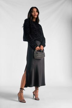 Say hello to the "Renzo" set - where comfort meets sophistication. The fuzzy sweater with its subtle shiny details exudes casual elegance. Paired with a metallic silky maxi skirt, it strikes a perfect balance between modesty and high fashion. Renzo is crafted for the modern woman seeking both style and comfort in one effortlessly chic ensemble. Elevate your wardrobe with this versatile blend of cozy and glamorous - because looking fabulous should always feel this good. Sweater And Slip Dress, Black Dress With Sweater Over It, Sweater Over Slip Dress, Layered Slip Dress Outfit, Slip Dress And Sweater, Sweater And Dress Layering, Slip Dress With Sweater, Dress With Sweater Over It, Layer Slip Dress