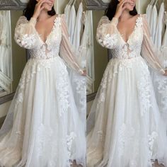 a woman in a white wedding dress standing next to a mirror