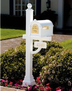 a white mailbox in front of a house