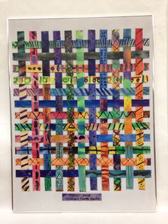 an art work made with colored paper and scissors on a white frame, in the shape of a square