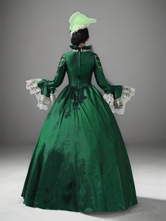 Unveil regal elegance in our Emerald Green Rococo Medieval Dress, a masterpiece crafted for the grandest occasions. This stunning gown merges the timeless allure of Victorian fashion with the opulence of Rococo aesthetics. The rich emerald fabric provides a lush backdrop for the intricate silver lace detailing that cascades through the tiers and adorns the bodice. Perfect for historical reenactments, themed weddings, or any event where making a majestic impression is a must. Each dress comes with a complementary headpiece, ensuring a polished ensemble. As an exclusive treat, each purchase of this majestic attire includes a complementary matching hat, ensuring your ensemble is as regal as a queen's. Fitted Victorian Ball Gown Medieval Dress, Regency Victorian Dress For Debutante Ball, Victorian Medieval Wedding Dress, Victorian Dress With Fitted Bodice, Floor-length, Elegant Fitted Ball Gown With Historical Design, Victorian Wedding Medieval Dress, Elegant Floor-length Victorian Dress For Costume Party, Elegant Historical Dresses For Costume Party, Regency Style Gown For Debutante Ball With Historical Design