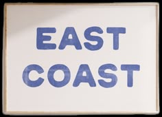 a sign that says east coast in blue ink on a white background with the words,'east coast '