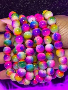 Royal Arm Candy Individual Bracelets feature 8mm or 10mm beads, making it the ideal accessory to adorn your arm and amplify its allure. What do you get: 1 bracelet Fits a 7" wrist but can stretch bigger 10mm beads Cheap Rainbow Stretch Bracelet With Colorful Beads, Cheap Handmade Neon Beaded Bracelets, Cheap Novelty Bracelets With Colorful Beads, Cheap Colorful Beads Stretch Bracelet For Festival, Cheap Rainbow Beaded Bracelets For Festivals, Cheap Novelty Rainbow Beaded Bracelets, Colorful Adjustable Stretch Bracelet With 8mm Beads, Neon Beaded Bracelets Gift, Neon Beaded Bracelet Gift