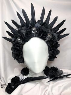 This piece is a gorgeous statement piece that consist of black flowers, feathers and silver and black lightweight skulls.  Perfect for Halloween, weddings, photoshoots and more.  Each piece is unique and made with love, passion and creativity. Queen Headpiece, Skull Queen, Halloween Weddings, Head Dresses, Black Flowers, Costume Hats, Headdress, Costume Accessories, Birmingham