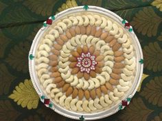 a white plate topped with lots of different types of food on top of a table