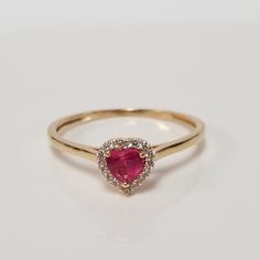 "Thanks for shopping our vintage estate store. We tend to sell well below wholesale and truly hope you enjoy all of our items. Many of the items are one of a kind, so please enjoy scrolling through the pictures and hopefully something will catch your eye. Blacks spots are from reflections. Beautiful estate 14k yellow white gold created ruby .25ct heart with .10ct cz diamond ring. Ring size: 7 Setting: 1/4\" 6.5mm Band width: 1.5mm Weight: 1.12 grams There are 16 cz diamonds. Beautiful ring, mark Classic Heart-shaped Ruby Ring For Formal Occasions, Classic Heart-shaped Ruby Ring, Classic Heart-shaped Ruby Promise Ring, Classic Ruby Ring For Anniversary On Valentine's Day, 14k Stamped Diamond Ring For Valentine's Day, Stamped 14k Diamond Ring For Valentine's Day, Classic Ruby Ring For Anniversary And Valentine's Day, Valentine's Day Yellow Gold Diamond Ring With Center Stone, Valentine's Day 14k Stamped Fine Jewelry Diamond Ring