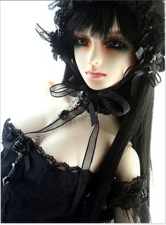 a mannequin with black hair and lace on it