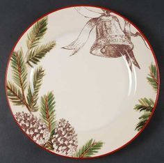 a christmas plate with a bell on it