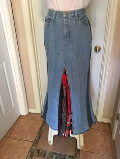 Upcycled blue denim jeans, size 38 inch waist (size 16 in womens) with side denim gussets with silk tie insert in front panel and back with A-line silhouette.  This is not hemmed to customize length.  From waist to hem is 42 inches. I can hem with your dimensions or you can take to a tailor (if you are not a sewer). Fitted Reworked Denim Blue Bottoms, Fitted Reworked Dark Wash Bottoms, Fitted Dark Wash Reworked Bottoms, Fitted Reworked Blue Denim Skirt, Fitted Medium Wash Recycled Denim Skirt, Fitted Recycled Denim Skirt With Pockets, Fitted Cotton Denim Skirt With Unfinished Hem, Fitted Denim Skirt With Unfinished Hem, Fitted Dark Wash Denim Skirt From Recycled Materials