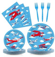 a set of four paper plates with airplanes on them