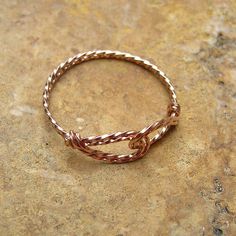 A fun and unique wirewrapped thumb ring made from twisted 14kt rose gold filled wire. The two interlocked swirls form a sort of infinity design, and the wire lays flat against your skin. Rose gold, or pink gold, is very fashionable these days! And I make this ring in a variety of sizes to fit everyone, no matter how big or small your finger may be! Modern Twist Wire Wrapped Rings For Gifts, Modern Twist Wire Wrapped Rings As Gift, Wire Wrapped Rings As A Modern Gift, Adjustable Rose Gold Wire Wrapped Ring, Adjustable Wire Wrapped Rose Gold Ring, Wire Wrapped Rose Gold Rings, Anniversary Rose Gold Wire Wrapped Jewelry, Twisted Wire Rings, Pink Gold Ring