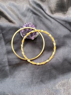 This is a pair of beautiful gold tone Monet Bangles with makers marks. They are Vintage but Timeless. They have an inside diameter of 2.5 inches and together they are 32 grams. One is plain, one is a twisted rope design. Both are very classy. Gold Hoop Bangle In Metal, Elegant Gold Nickel-free Bangle, Nickel-free Gold Metal Bangle, Twisted Gold Metal Jewelry, Gold Spiral Bracelet As Gift, Gold Spiral Bracelet For Gift, Bangle Bracelet Set, Vintage Monet, Rope Design