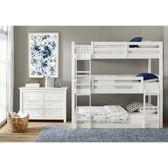 a white bunk bed sitting in a bedroom next to a dresser and mirror on top of a wooden floor