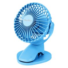 a small blue fan sitting on top of a stand