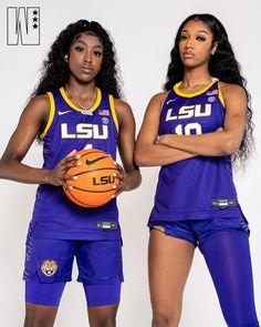 two women in purple uniforms holding a basketball