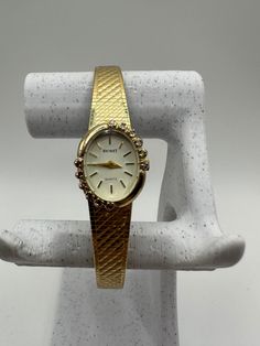 Behold the rare and exquisite Nicolet vintage ladies diamond Quartz watch in a captivating gold tone - an exceptional gift for her. This fashion designer timepiece features a tastefully adjustable strap, ensuring a perfect fit for any wrist. In good shape and adorned with diamonds, it radiates timeless allure. Fitted with a new battery, this watch seamlessly combines style and functionality, making it an extraordinary accessory for women with a discerning taste for unique and elegant pieces. Comes with a Swiss eta movement  Please message me with any questions Gold Diamond Jewelry And Watches For Evening, Antique Yellow Gold Diamond Watch For Formal Occasions, Vintage Yellow Gold Jewelry And Watches For Evening, Elegant Yellow Gold Jewelry For Evening, Antique Gold Watches With Diamond Hour Markers, Gold Formal Watch With 17 Jewels, Gold Watches With Diamond Accents For Evening, Gold Evening Watches With Diamond Accents, Gold Watches With Diamond Accents For Wedding