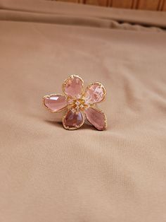 Pink glass flower ring.  The flower measures 1.75 inches and the band is cut adjustable in the back and sized to US 7.75.  Gold plated. Elegant Adjustable Pink Flower Ring, Adjustable Crystal Flower Ring, Elegant Pink Flower Ring For Party, Adjustable Flower Ring For Party, Rose Gold Flower Rings For Party, Formal Pink Flower Ring, Adjustable Flower Crystal Ring, Pink Magnolia Flower, Pink Magnolia