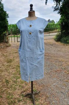 Amazing Authentic Vintage GIVENCHY Designer Pale Blue Soft Denim Shift Dress with Signature Pocket(s),Logo'd Gold Buttons,Zip Fastening,Just Fabulous,very on-trend,Versatile and simply Gorgeous  Fabulous Unique Vintage French Paris GIVENCHY Monogrammed Signature Pocket Denim Dress,Simplistic Colour & Design,Pale Blue Colourway,Superb Condition making a Fabulous Wardrobe Addition.Lightweight and Comfortable Smart Casual style Authentic and Fabulous Paris Fashion featuring Sublime Simplistic design and Colour with Gold Logo'd Buttons on a Split Neckline with Zip reverse Fastening Discovered at a recent Paris Street Brocante- beautifully preserved in Fabulous condition throughout-it is in Wonderful Vintage Condition Fits perfectly on My Stockman Mannequin which is a French size 40 / UK 12-Gen Fitted Denim Dress With Pockets For Daywear, Denim Blue Dresses With Pockets For Daywear, Vintage Blue Denim Dress With Pockets, Denim Blue Dress With Pockets For Daywear, Vintage Short Sleeve Denim Dress With Pockets, Vintage Denim Blue Dresses With Pockets, French Paris, Vintage Givenchy, Smart Casual Style