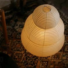 a lamp that is on top of a rug