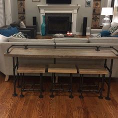 a living room filled with furniture and a flat screen tv mounted on the wall above a fireplace