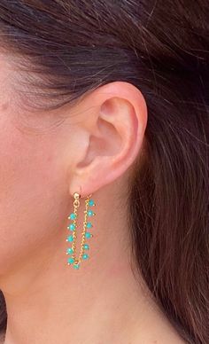 These lovely chain earrings feature a non-tarnish 4mm gold ball stud earring and are connected to a gold chain, which has been adorned with mini turquoise-coloured faceted beads. Perfect on its own or as part of an earring stack. MATERIALS: ��▪️ Non-tarnish 4mm gold plated ball earring ▪️ Gold plated chain   ▪️ Turquoise coloured faceted mini beads DIMENSIONS: Length - 8 cm Width - 4mm ball earring Rose Gold Drop Earrings, Blue Gemstone Earrings, Horn Earrings, Gold Chain Earrings, Blue Drop Earrings, White Beaded Necklaces, Blue Crystal Earrings, Green Beaded Necklace, Blue Beaded Necklace