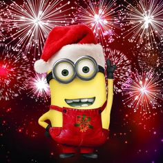 a minion wearing a santa hat with fireworks in the background