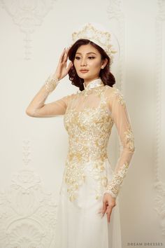 Elegance and grace take center stage with our Jiayi White Vietnamese Ao Dai, a timeless and enchanting choice for your special day. With an illusion neckline and back, this gown creates an ethereal and captivating aura. Long sleeves add a touch of classic beauty creating a sophisticated look. The exquisite couture lace adorns the entire ensemble, adding a luxurious and intricate touch. Embrace tradition and elegance in our Ao Dai, a gown that will make you feel like a vision of beauty on your wedding day Detail: White Vietnamese Ao Dai Collar: 1.4in/ 3.5cm Illusion neckline Illusion back Long sleeves Bra cups added Zipper closure White chiffon pants Sweep train (12''/30cm) Couture lace Made to order White Ao Dai Wedding Dress, Ao Dai Wedding Dress, Bridal Ao Dai, Wedding Ao Dai, Vietnamese Wedding Dress, Ao Dai Wedding, Ao Dai Vietnamese, Vietnamese Wedding, Chiffon Pants