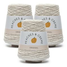 three balls of white twine with peaches and creme logo on the front