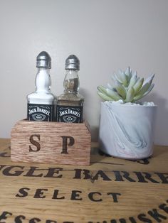 Novelty upcycled salt and pepper shakers. upcycled jack daniels bottles turn into a great unique gift idea for any occasion. This item is made to order. All our items come pre filled with the silver caps on top and presented in the wooden stand. Jack Daniels No 7, Jack Daniels Bottle, Silver Caps, Jack Daniels, Wooden Stand, Salt And Pepper Shakers, Salt Pepper Shakers, Salt Pepper, Gift Registry