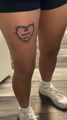 a person with a tattoo on their leg