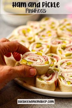 ham and pickle pinwheels on a plate with text overlay that reads ham and pickle pinwheels