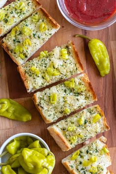 slices of garlic bread with green peppers and sauces on the side next to them