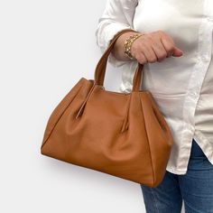 The leather handbag can be a great addition to any outfit and an excellent helper for every day. It is convenient to carry a tablet, wallet, documents, books, keys everything you need to have at hand. Ortece makes products in full grain Italian leather. This, like all products, is handmade in Italy by old artisans (know-how passed down from generation to generation). The leather bag comes with a 100% cotton dust bag that is to be used when it is stored. Dust bag protects it from the sun, dust, s Italian Leather Handbags, Italian Bags, Know How, Handbag For Women, Elegant Bags, Handbags Leather, Brown Leather Bag, Leather Bag Women, Leather Care