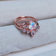 Magical Round Moonstone Ring, Silver Moonstone Ring For Wedding, Silver Rose Cut Diamond Moonstone Rings, Magical Silver Moonstone Wedding Ring, Unique Moonstone Wedding Ring, Magical Moonstone Wedding Rings, Rose Gold Moonstone Ring With Rose Cut Diamonds, Ethereal Moonstone Crystal Ring, Silver Opal Promise Ring With Rose Cut Diamonds