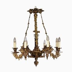 an antique chandelier with five lights