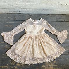 "Flower Girl Dress champagne  Outer net layer with appliqué flowers  Long net bell sleeves  Cotton lining and back zipper  Size - 3 Armpit to Armpit - 11\" Arm - 15 Shoulder - 9\" Length - 22\" Condition - Very Good Vintage" Fitted Lace Dress For Dress-up In Spring, Spring Lace Dress For Dress-up Occasions, Spring Lace Dress With Lace Trim For Dress-up, Spring Cream Long Sleeve Lace Dress, Cute Long Sleeve Lace Dresses, Cream Lace Dress For Spring Party, Cream Lace Dress For Spring, Spring Cream Lace Dress, Appliqué Flowers