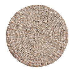 a round woven placemat on a white background