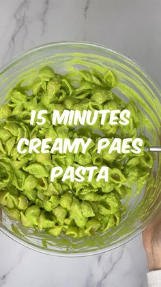 a bowl filled with green pasta and the words 15 minutes creamy peas pasta in it