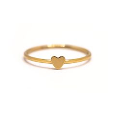 description A modern tiny heart on a classic thin band. A must-have for Stacker Rings. Thick 14K Gold plating will make this ring last a lifetime! end description materials Gold Vermeil Hypoallergenic, lead and nickel free end materials details Heart Height 3.5mm Band 1mm end details sku #R108 end sku Stackable Rings Gold, Rings Thick, Minimal Rings, Cute Promise Rings, Preppy Gifts, Run The Jewels, Stackable Rings Silver, Stacker Rings, Minimal Ring