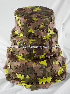 three tiered cake decorated with green and brown camo icing on white background